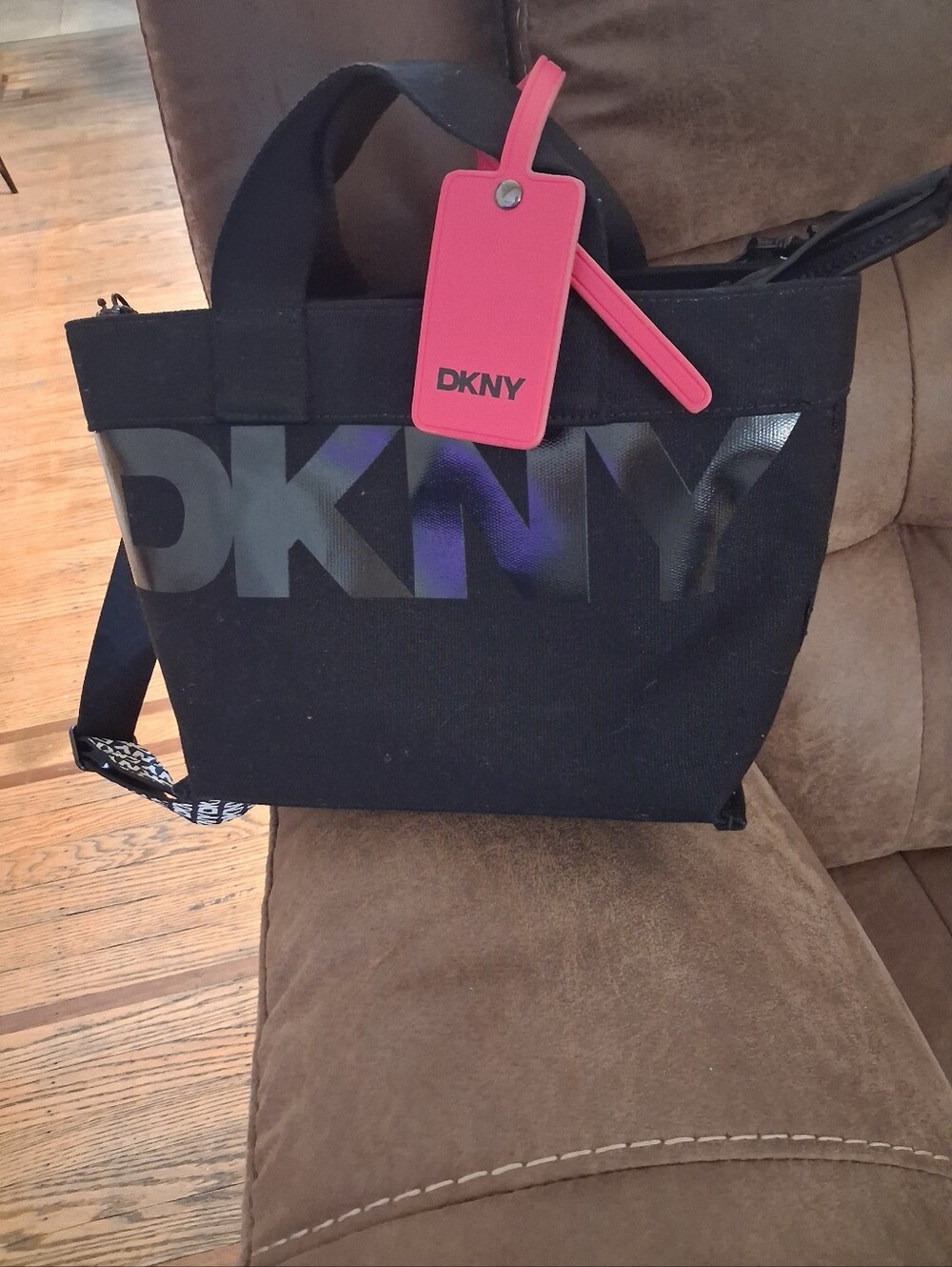 DKNY Black Canvas Tote with Pink Luggage Tag
